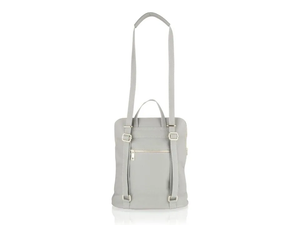 After: Gray backpack. In a white cove on a glossy base with a black curtain in view; cut out on white with its reflection kept.